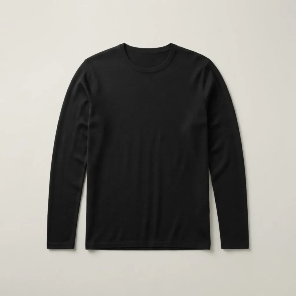 Camiseta de lana merino Kelpa Merino 150 manga larga, color negro, extendida en plano